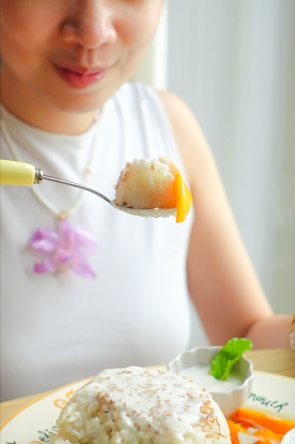 A person taking a bite of the delicious final result.