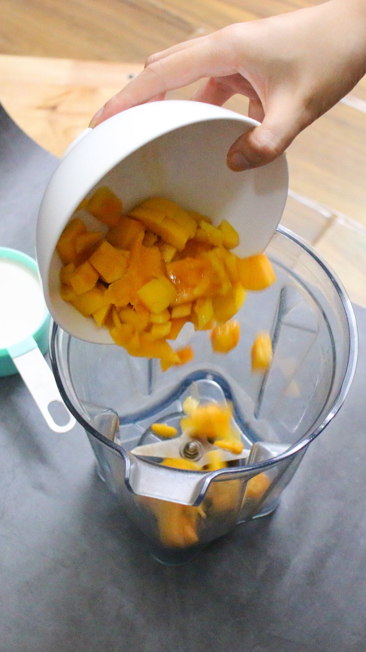 Add mango cubes to blender