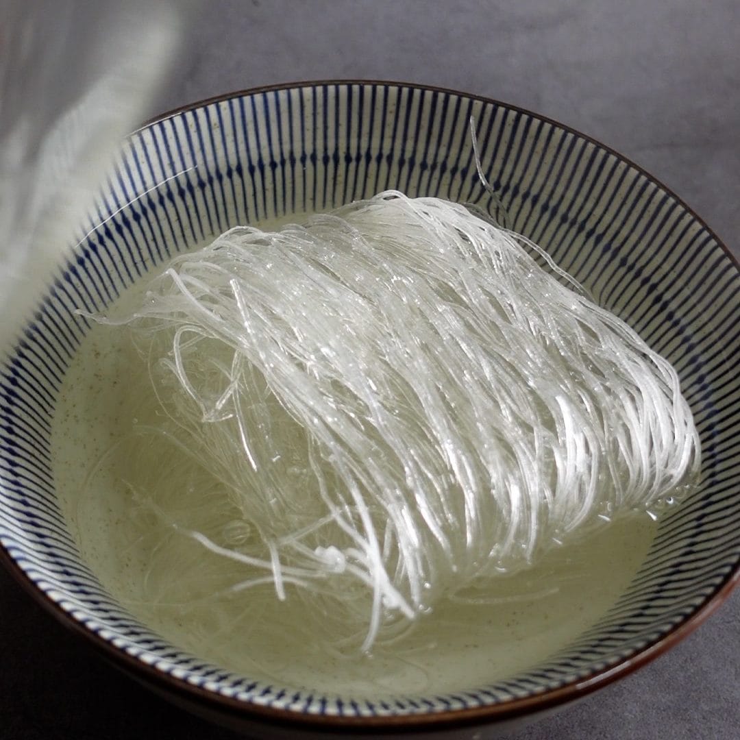 Add hot water to glass noodles