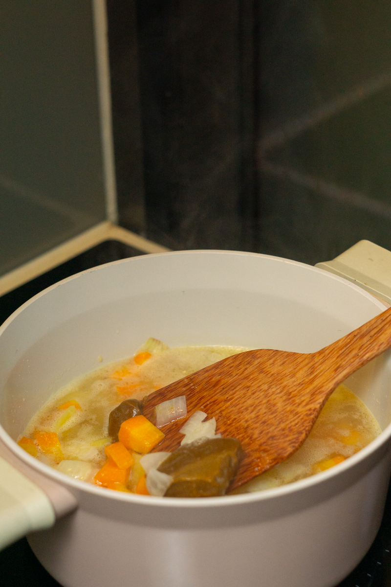 adding curry cubes in the broth