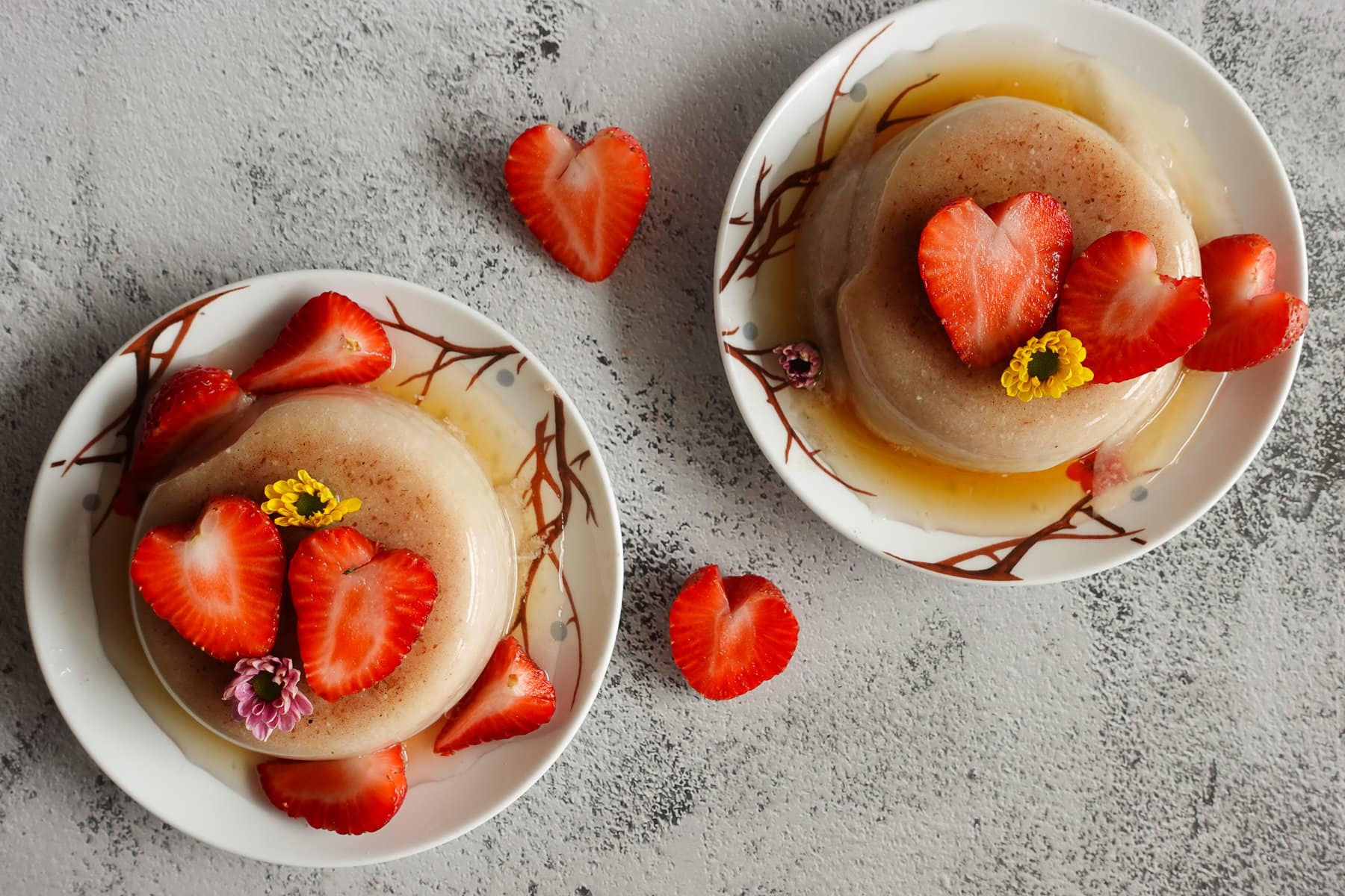 two dishes of almond tofu with strawberries