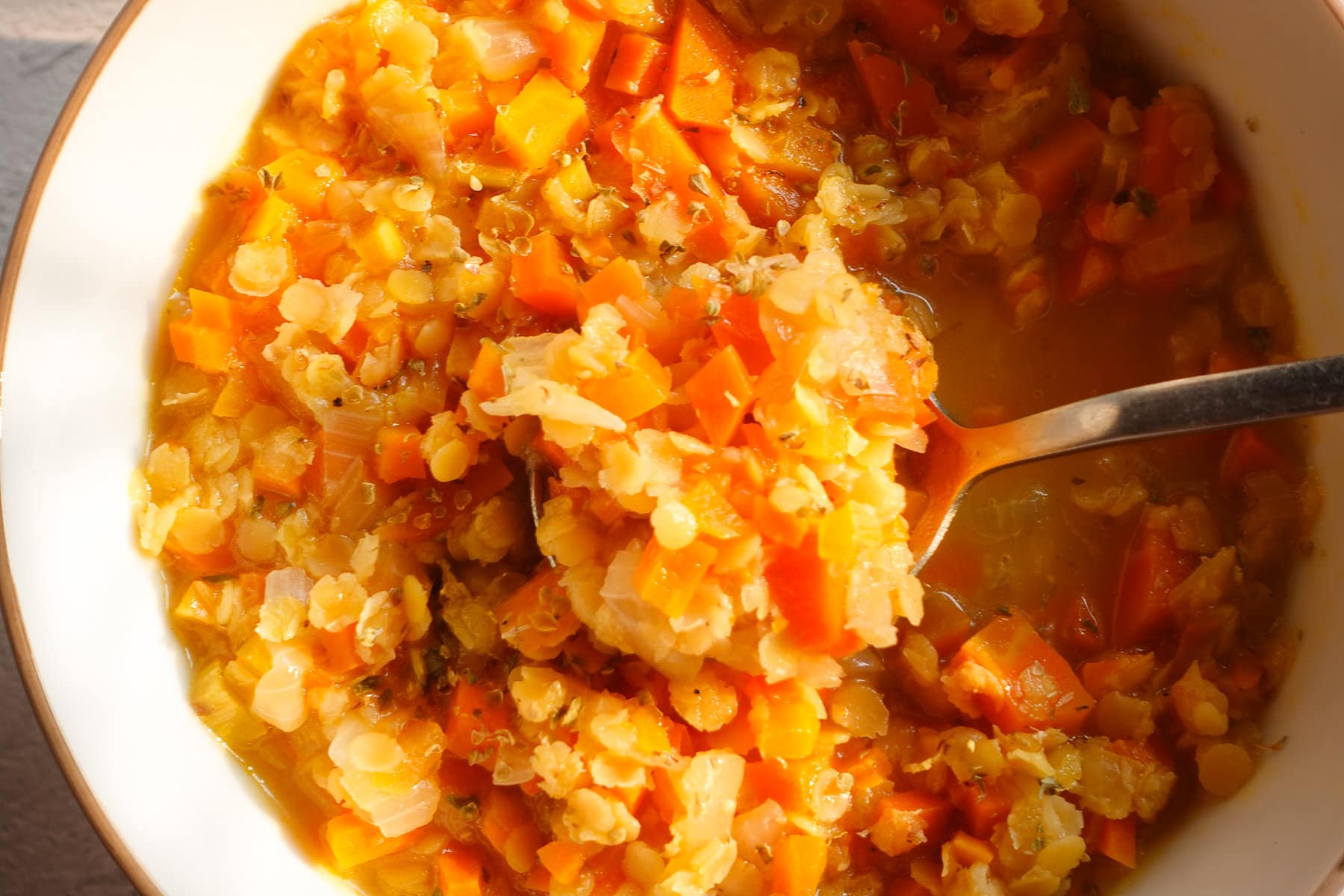 Simmer the red lentil carrot soup until soft and tender