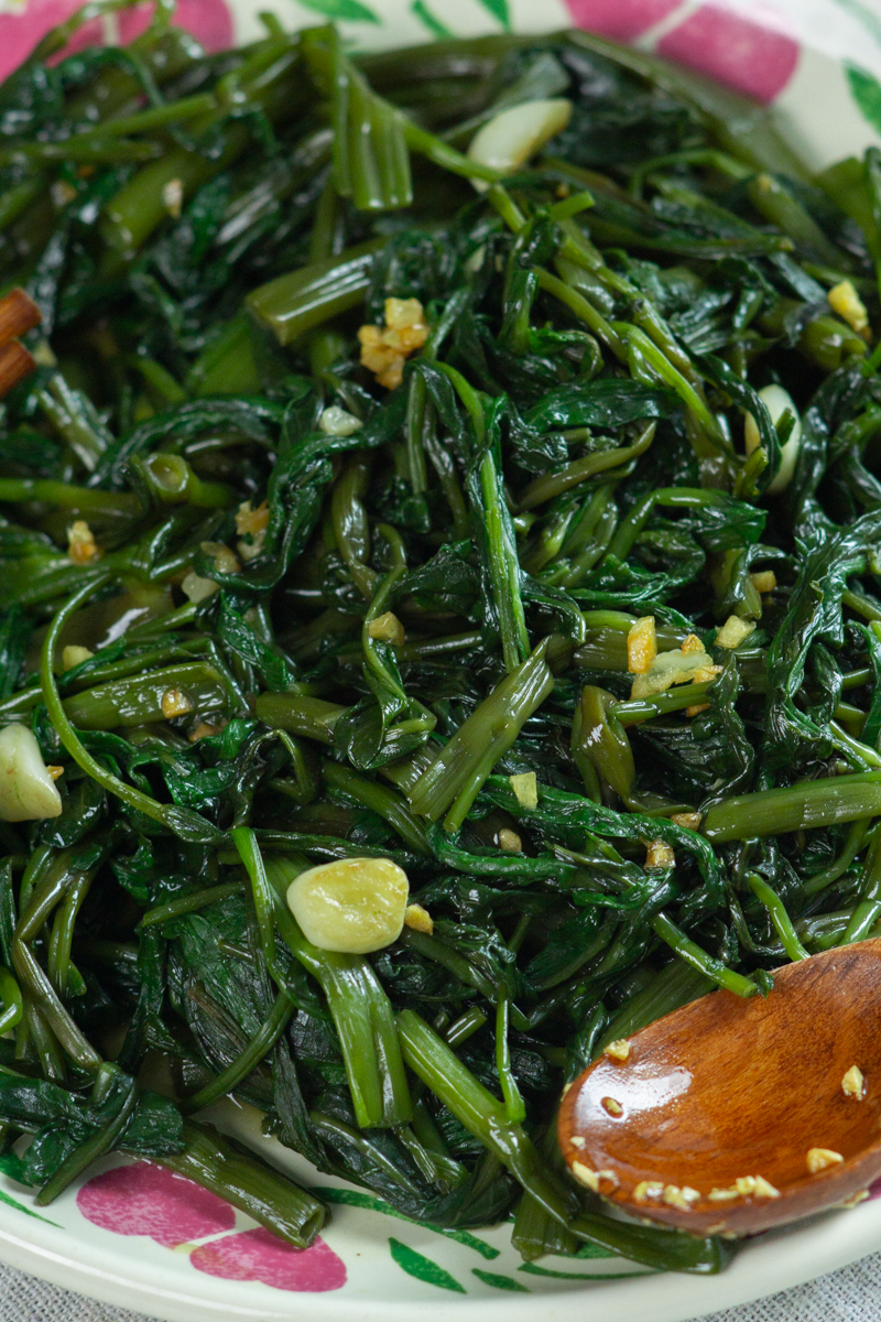 serving the morning glory drizzled with garlic oil
