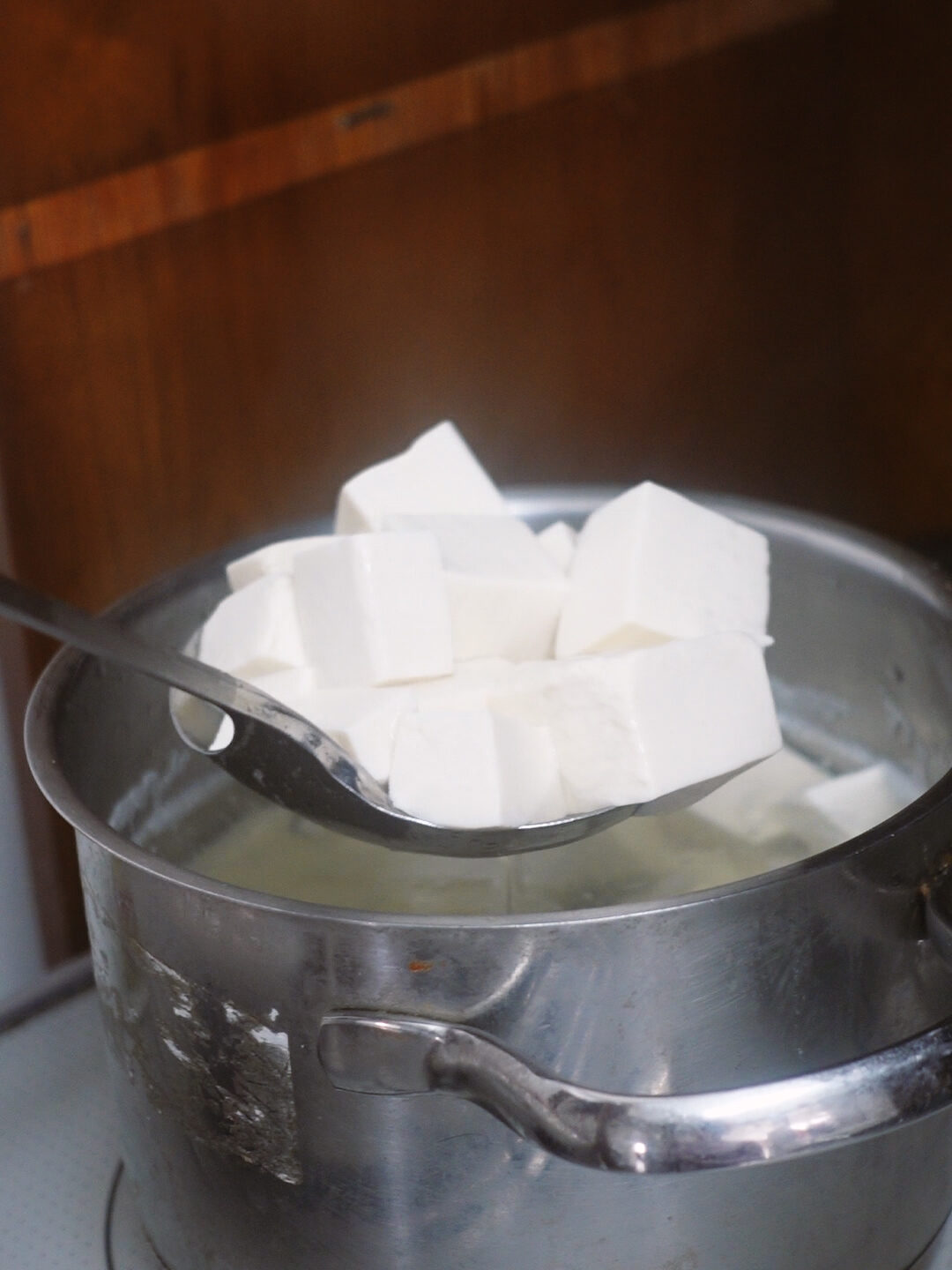 Blanch the tofu in salted water