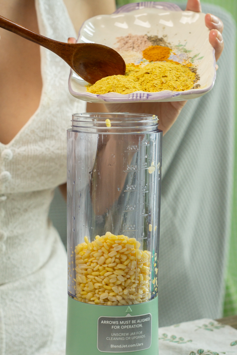 adding the spices to a blender