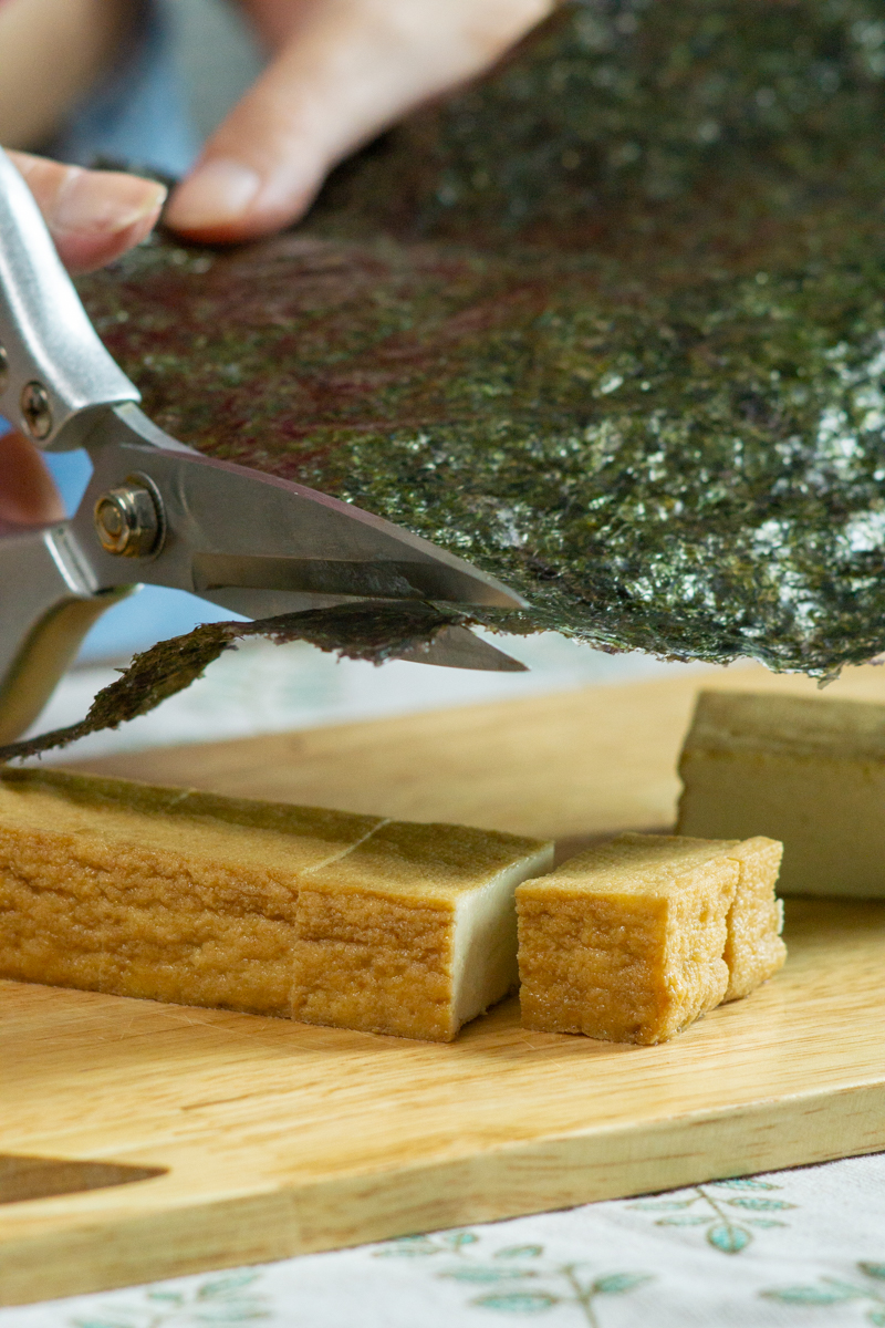 cutting the nori sheet into thin strips