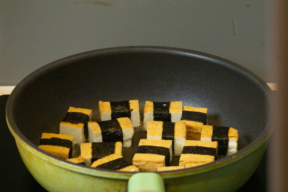 frying the tofu in a pan