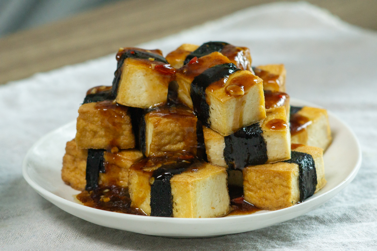 a plate full of nori wrapped tofu