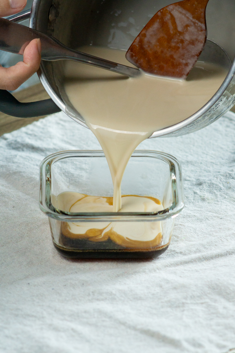 pouring the custard over the caramel
