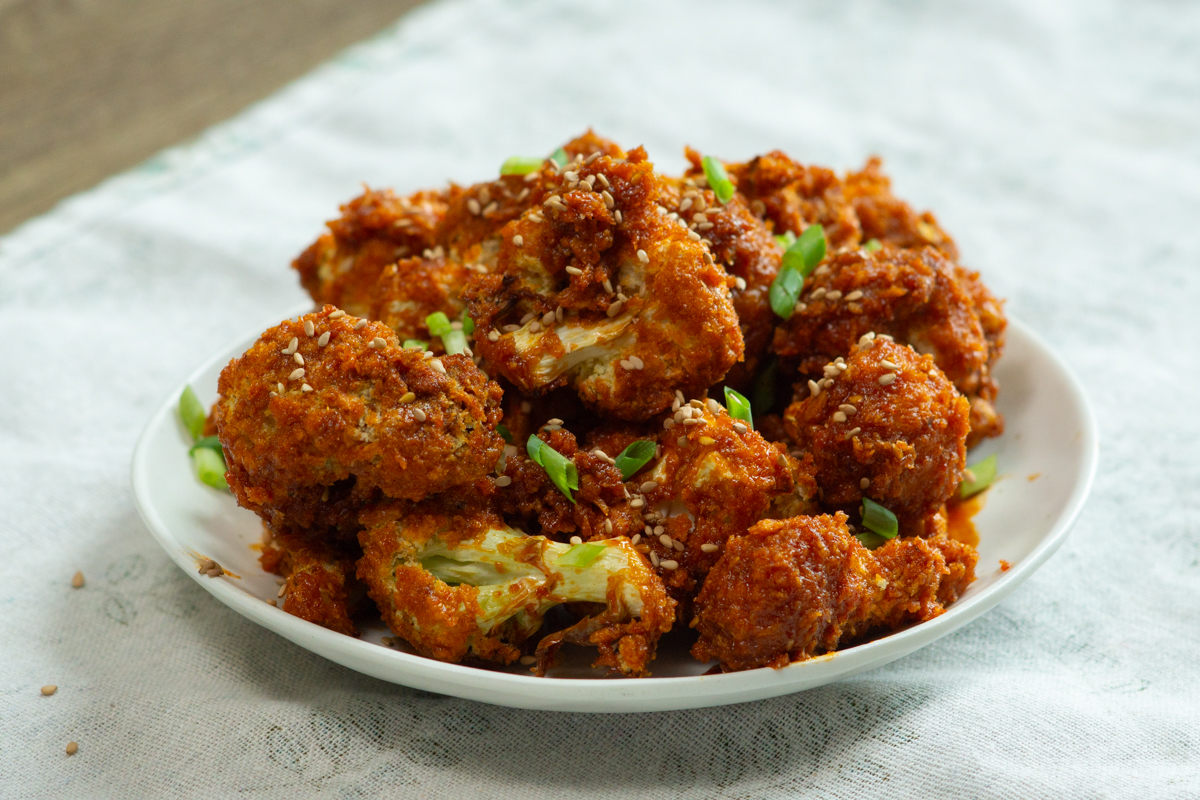 a plate full of Gochujang Cauliflower drumsticks