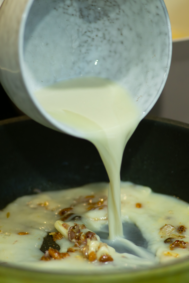 adding soy milk to make the sauce