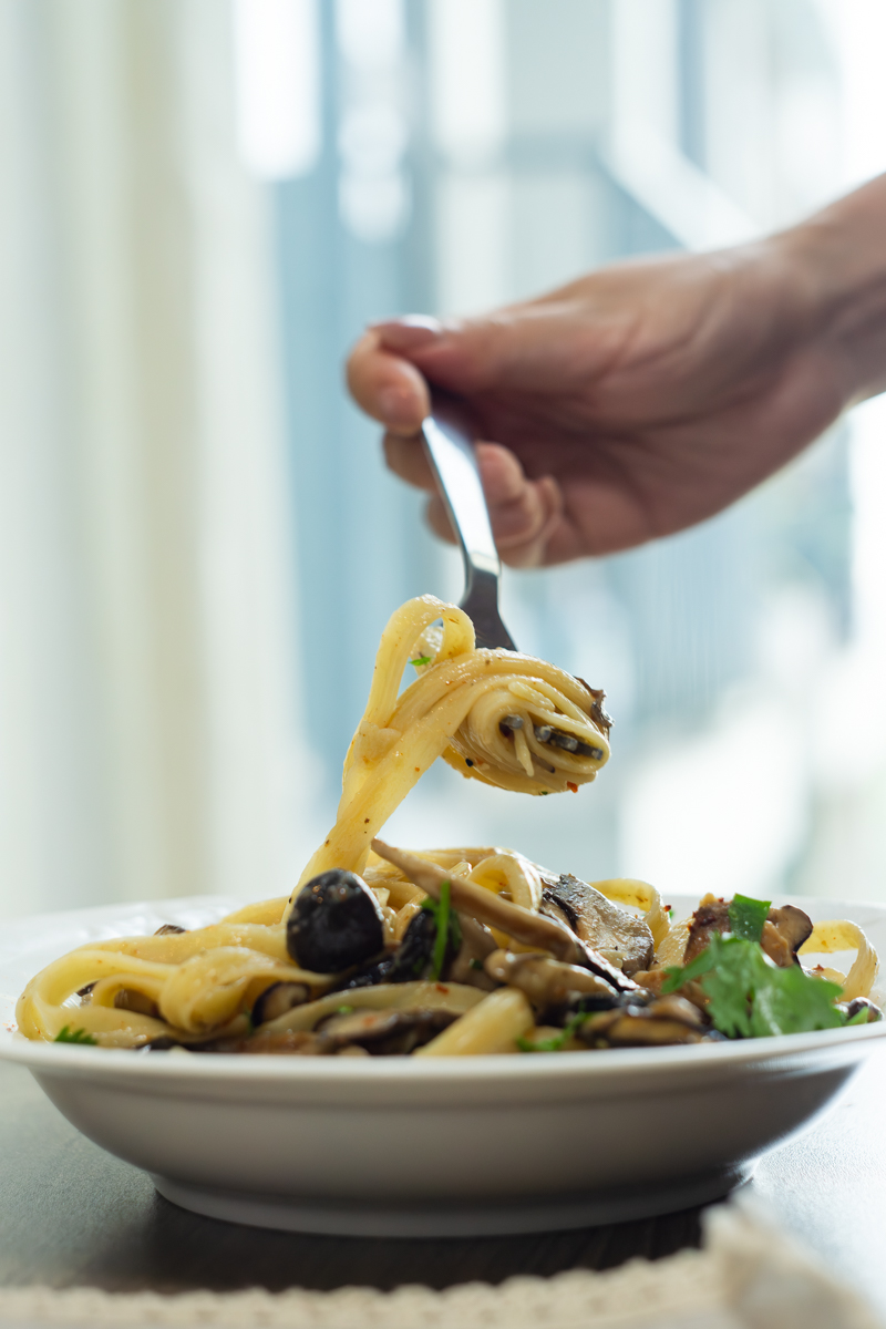 indulging pasta with a fork