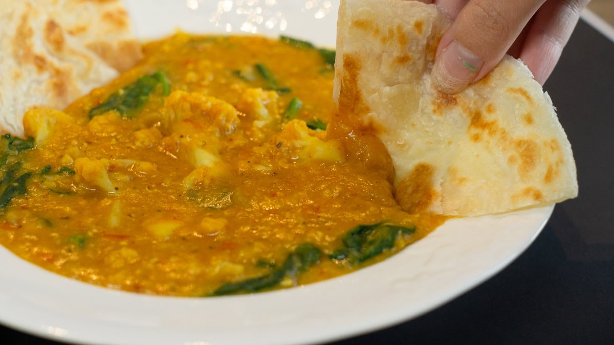 eating Sweet Potato, Cauliflower and Lentil Curry