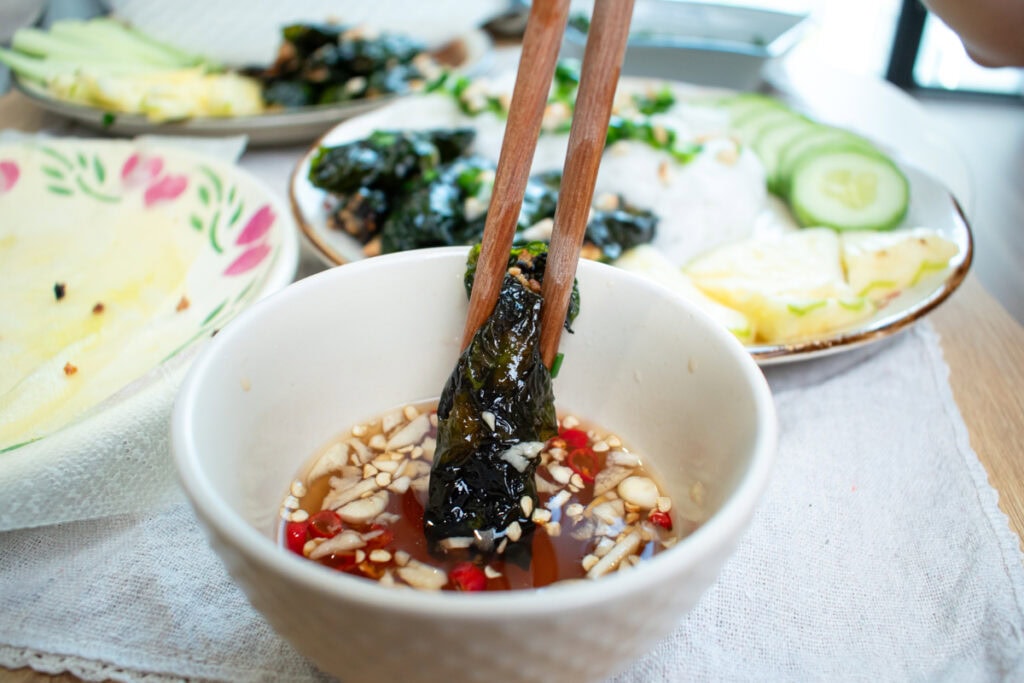 Vegan Betel Leaf Rolls dipped in vegan fish sauce